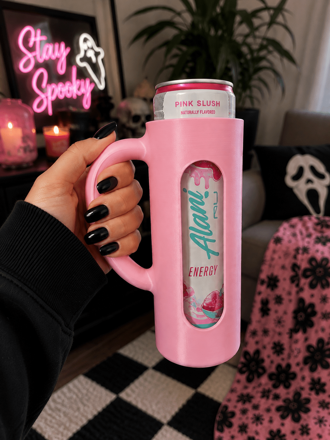 Rainbow gradient 3D printed skinny can holder with handle holding an Alani Nu Pink Slush energy drink